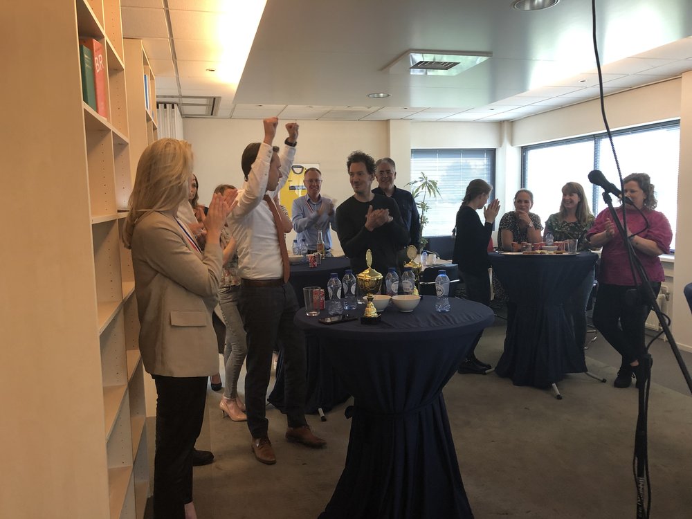 Colleagues applaud the winners at the Boskamp Willems office